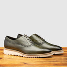 Pair of Q548 Calzoleria Toscana Emerald Green Onice Two Piece Oxford on top of a wooden table
