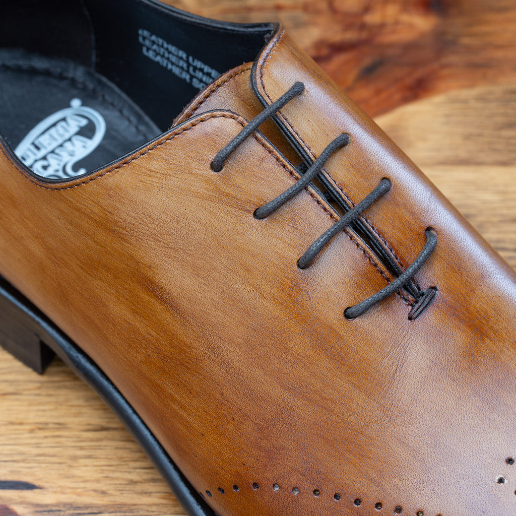 Up close picture of the vamp showing the 4 piece eyelet of Q550 Calzoleria Toscana Chestnut Cayenne Calf Wholecut