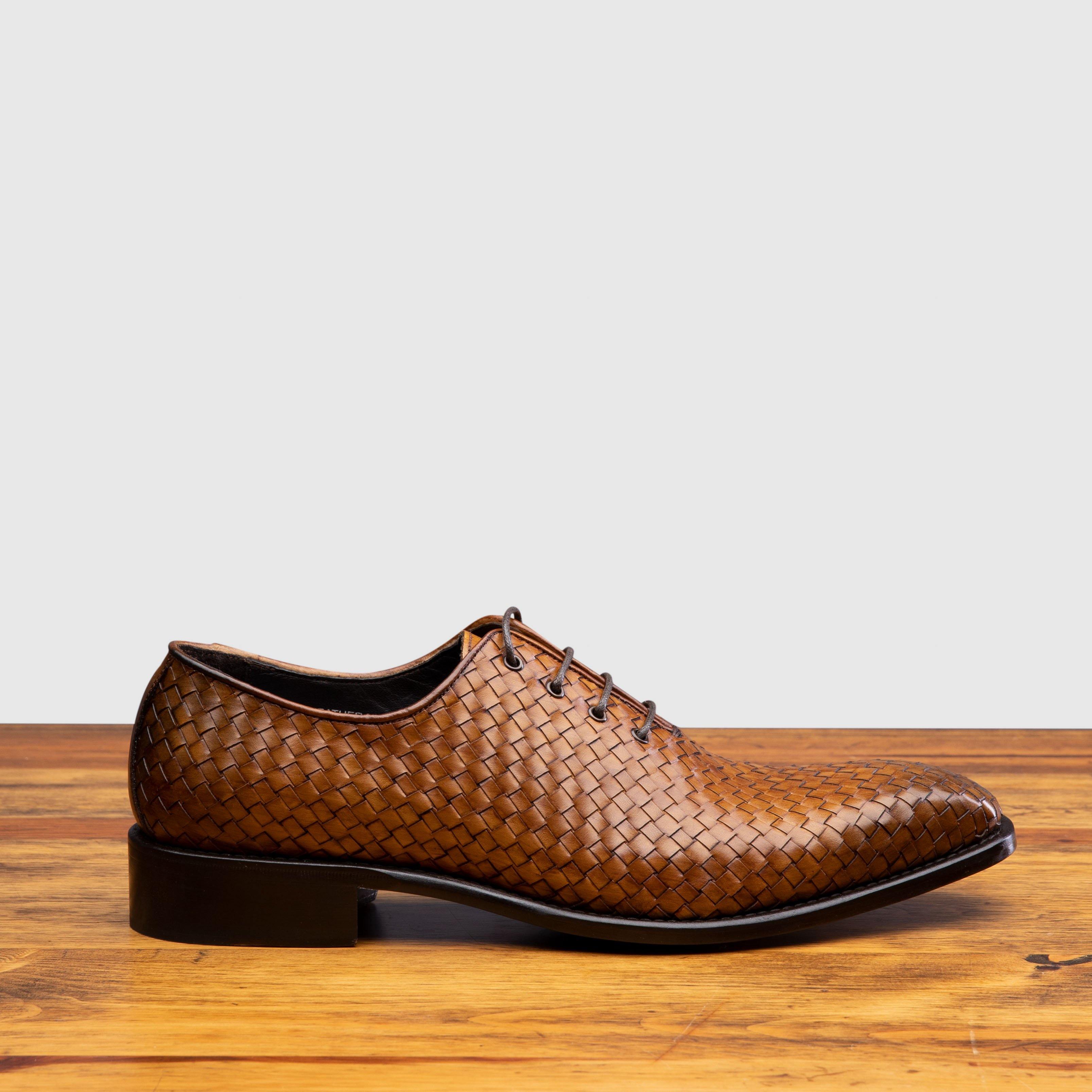Side profile of 5373 Calzoleria Toscana Chestnut Woven Lace-Up on top of a wooden table