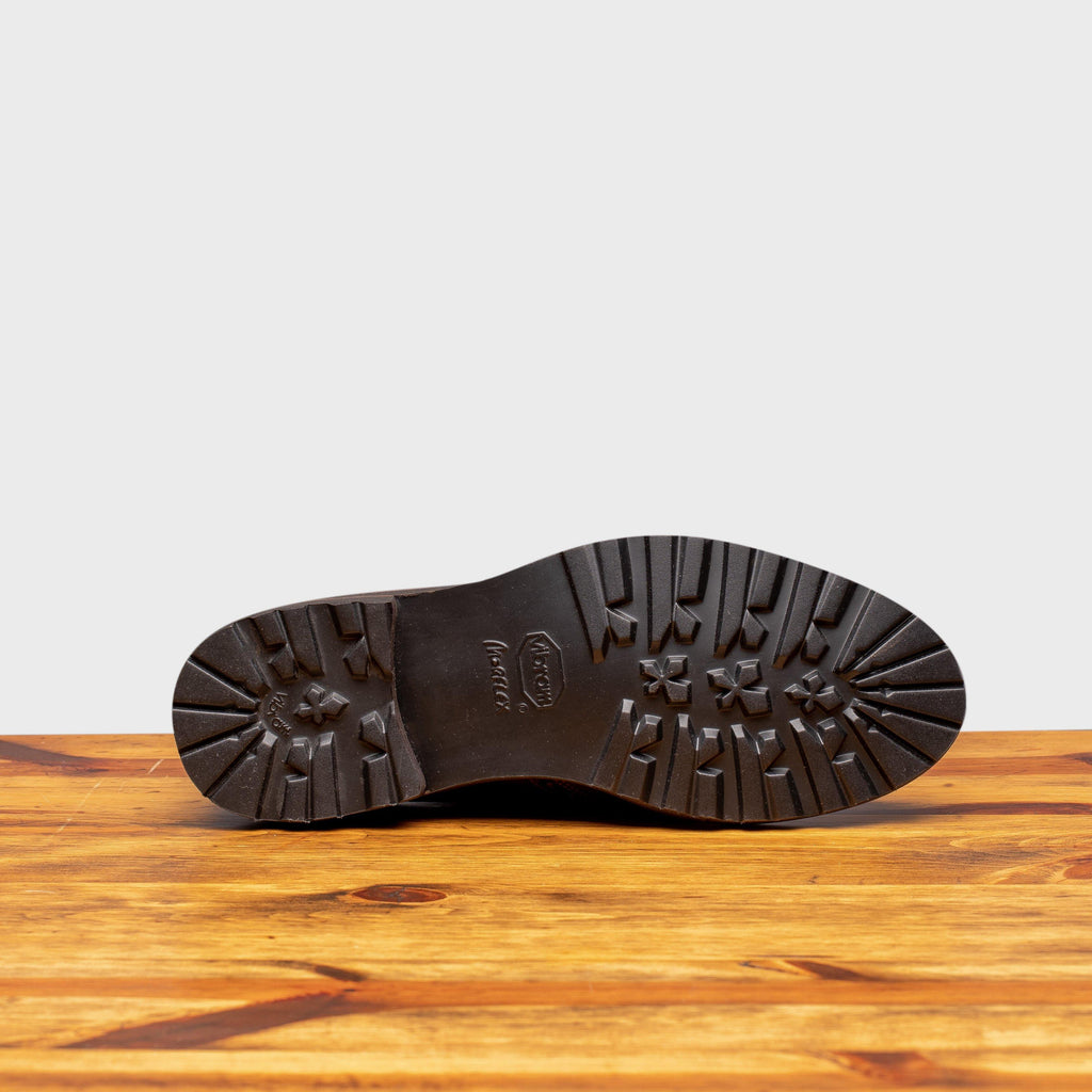Full Rubber Vibram Morflex Outsole of D277 Calzoleria Toscana Women's Brown Dip-Dyed Wingtip on top of a wooden table