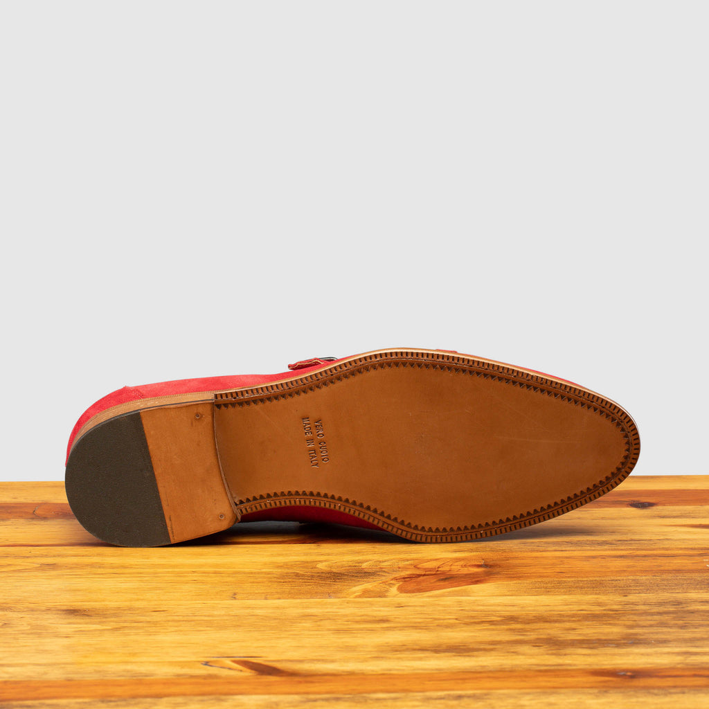 Full leather outsole of Z893 Calzoleria Toscana Red Suede Double Strap Low Vamp Slip-on on top of a wooden table