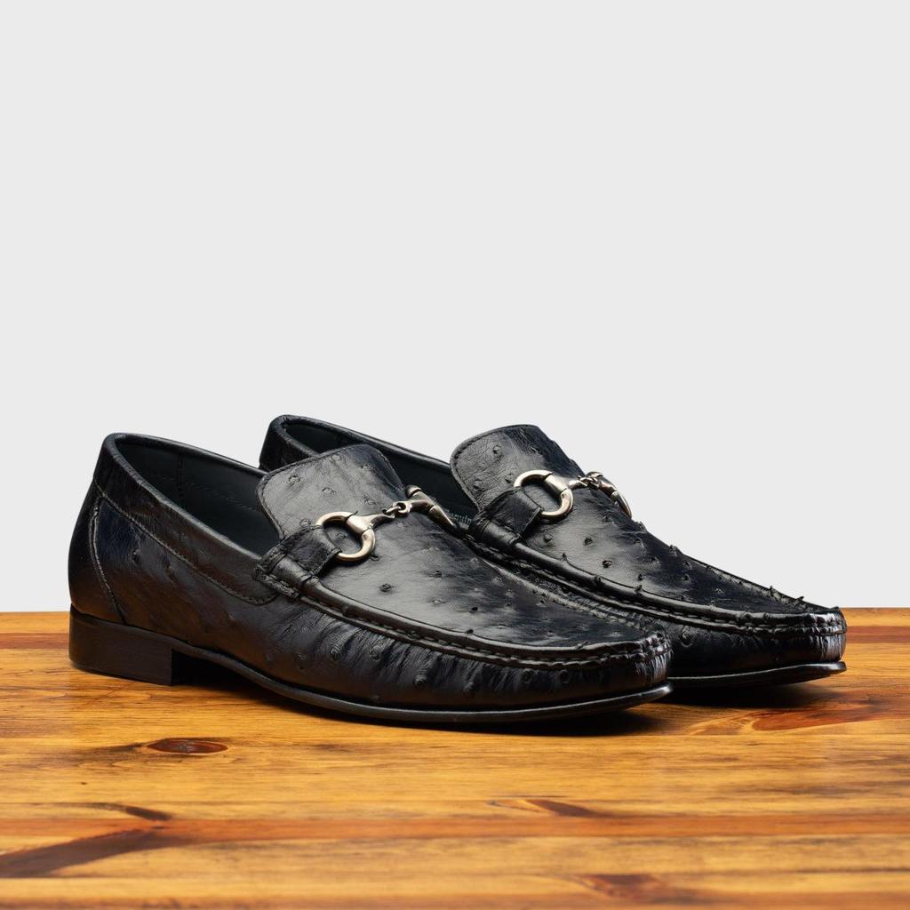 Pair of the 3238-M Calzoleria Toscana Ostrich Dress Slip-On on top of a wooden table